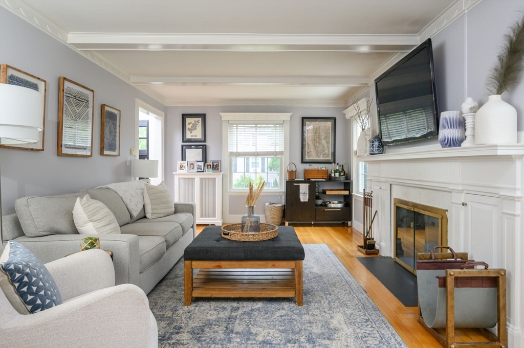 45 Rowe Street Milton, MA 02186 - Photo 11 of 34 a living room with furniture and a fireplace