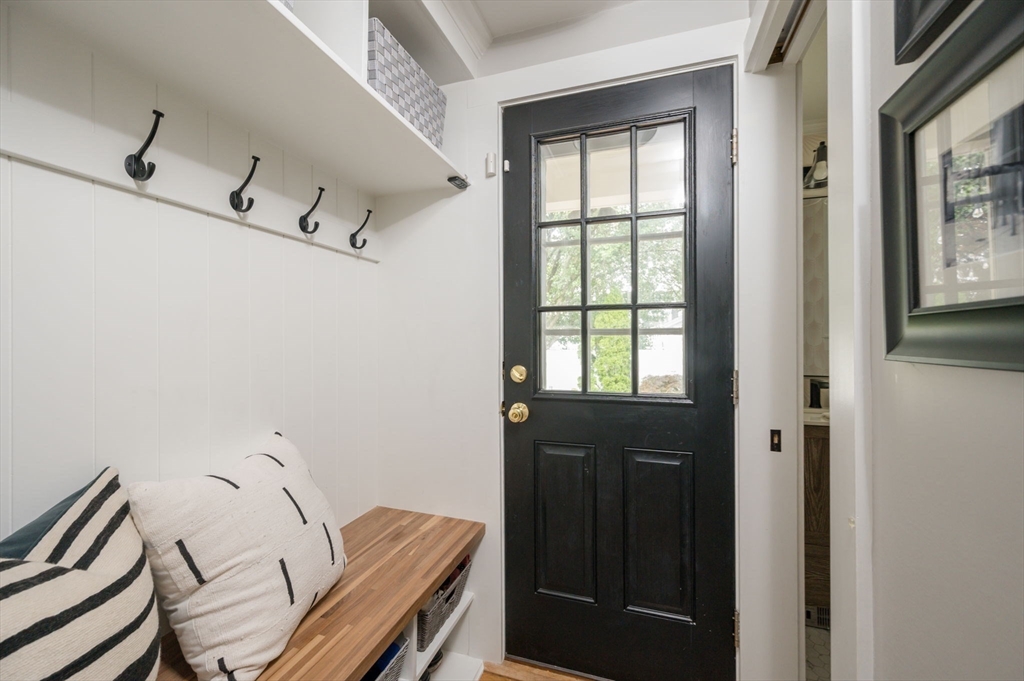 45 Rowe Street Milton, MA 02186 - Photo 12 of 34 a view of a hallway with seating area
