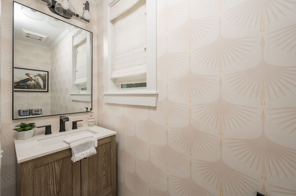 45 Rowe Street Milton, MA 02186 - Photo 13 of 34 a bathroom with a sink and a mirror