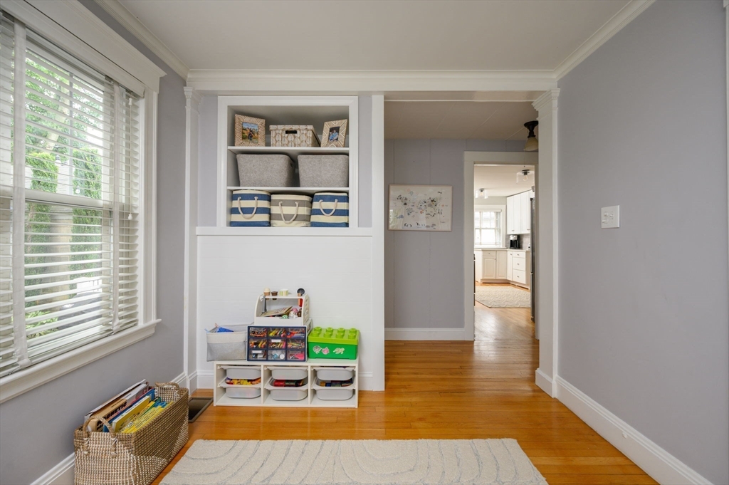 45 Rowe Street Milton, MA 02186 - Photo 15 of 34 a room with wooden floor and a window