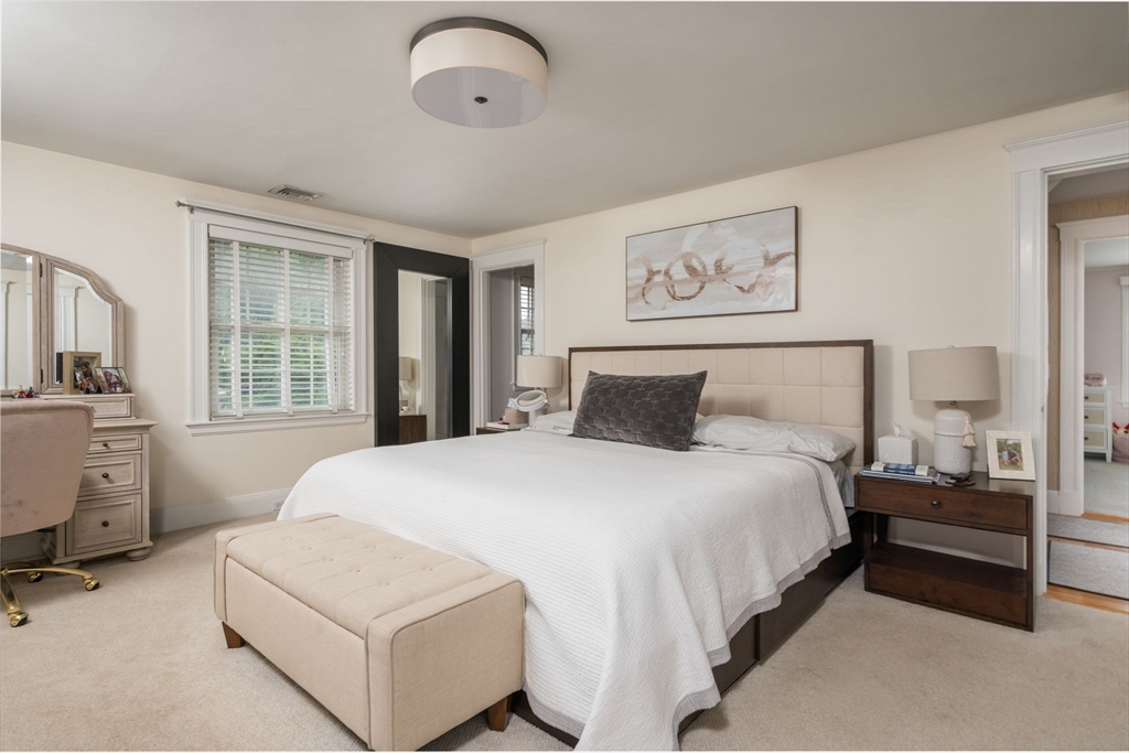 45 Rowe Street Milton, MA 02186 - Photo 16 of 34 a bedroom with a large bed and a window