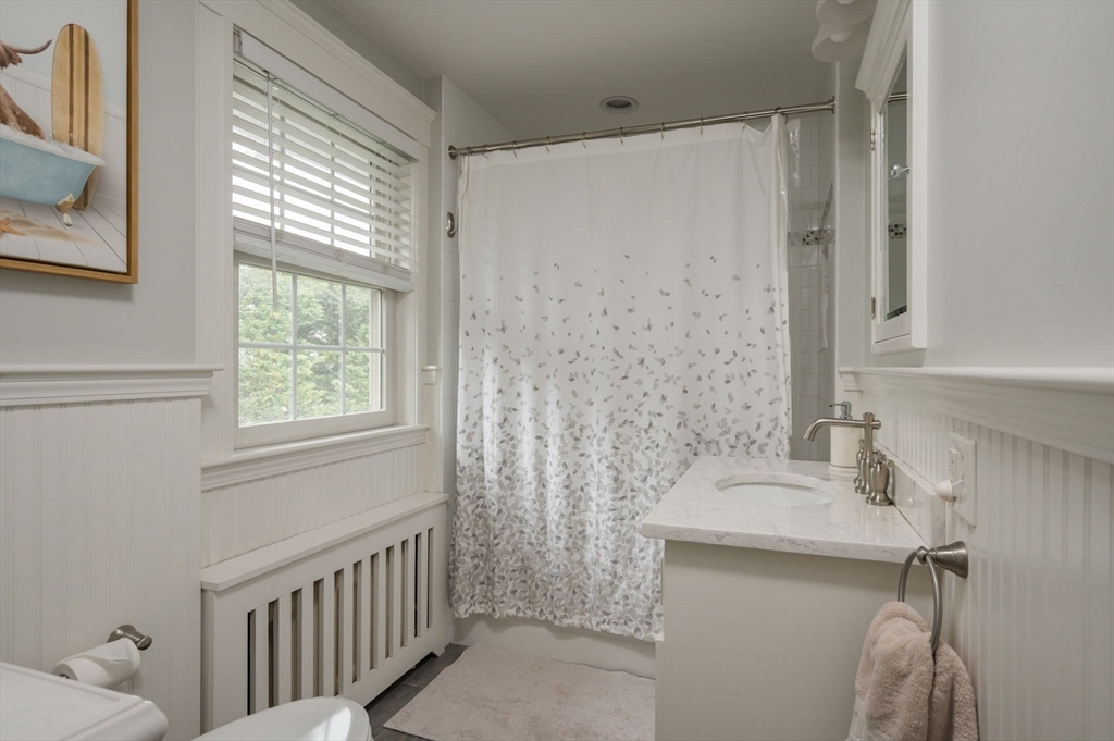 45 Rowe Street Milton, MA 02186 - Photo 18 of 34 a bathroom with a sink a toilet and shower