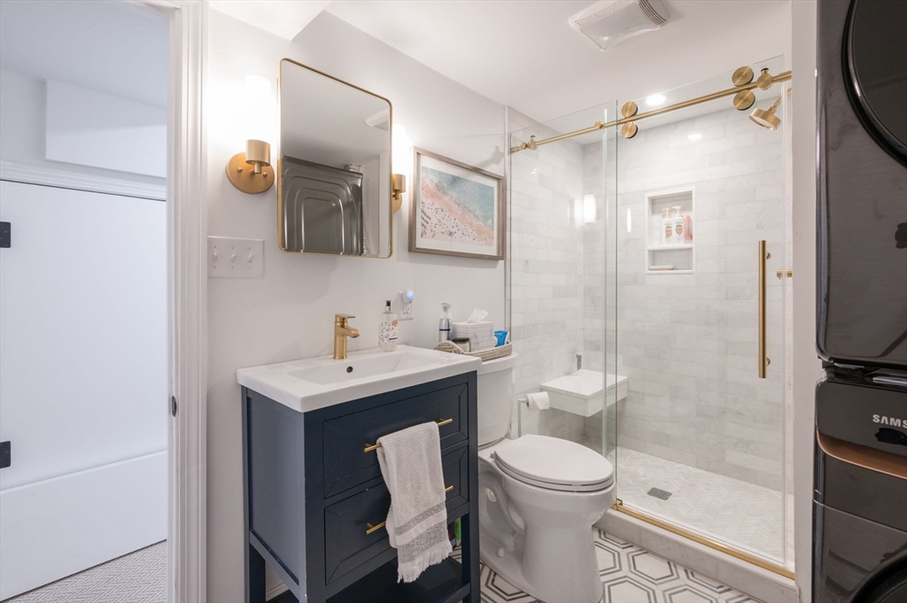 45 Rowe Street Milton, MA 02186 - Photo 24 of 34 a bathroom with a toilet a sink and shower