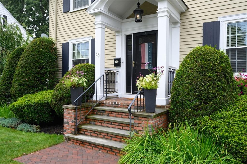 45 Rowe Street Milton, MA 02186 - Photo 26 of 34 a front view of a house with a garden