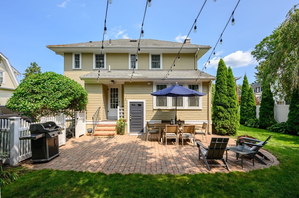 45 Rowe Street Milton, MA 02186 - Photo 27 of 34 a view of a house with backyard sitting area and garden