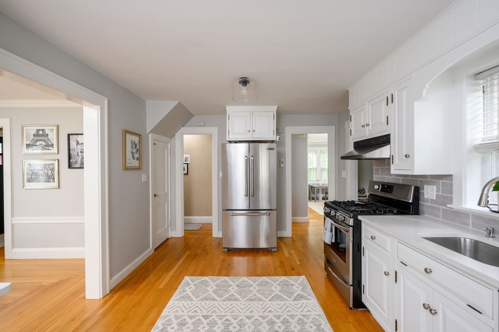 45 Rowe Street Milton, MA 02186 - Photo 5 of 34 a kitchen with stainless steel appliances granite countertop a refrigerator stove and sink