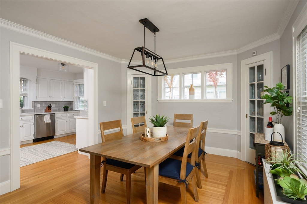 45 Rowe Street Milton, MA 02186 - Photo 7 of 34 a view of a dining room with furniture window and wooden floor