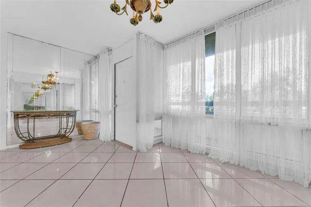 a spacious bathroom with a glass shower door and a window