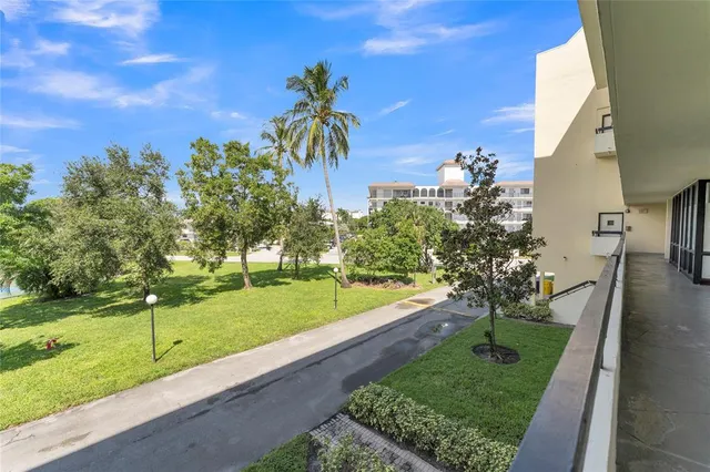 an aerial view of residential houses with yard