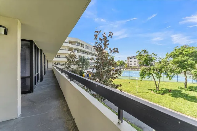 a view of swimming pool from a balcony