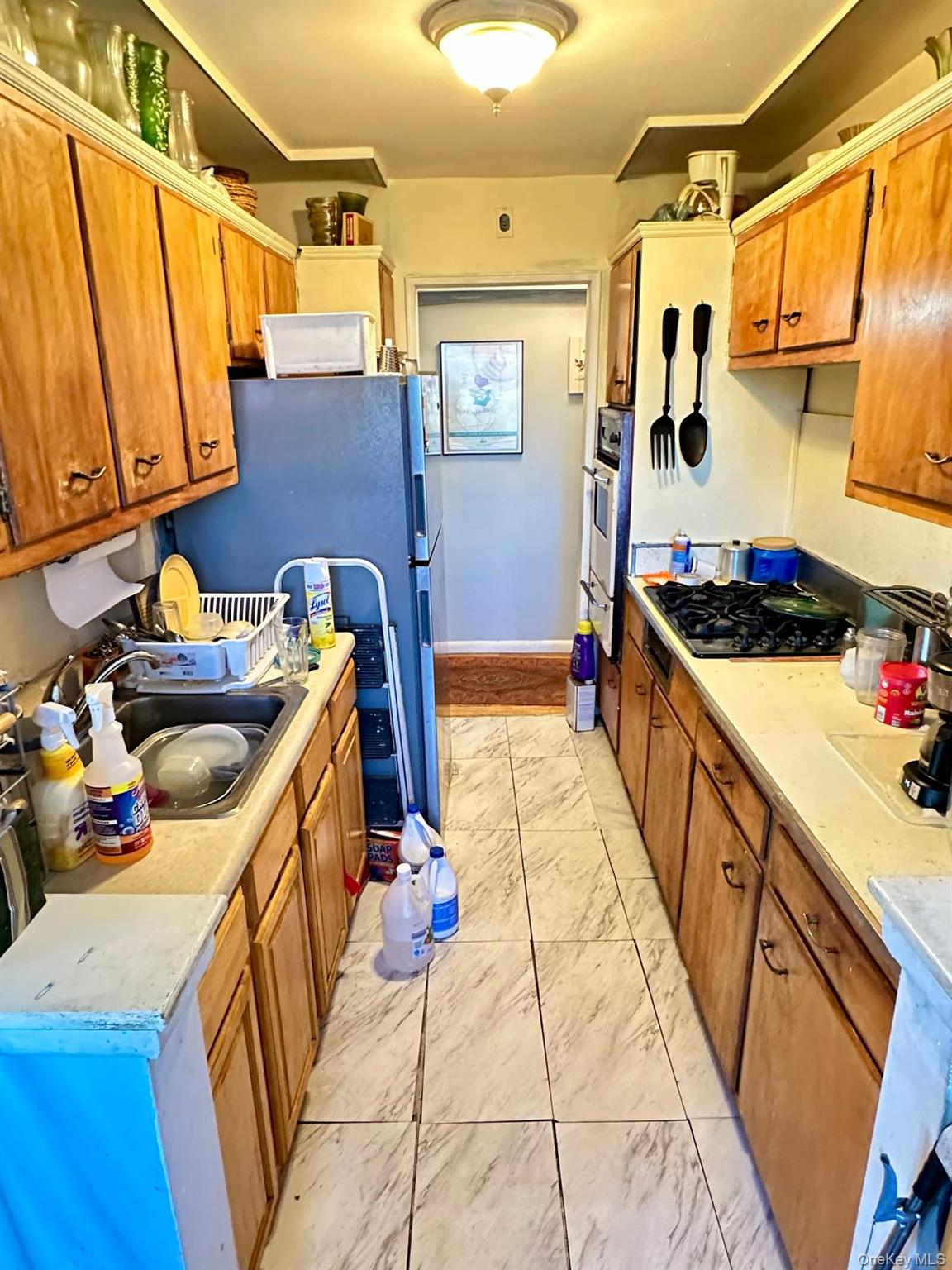 99-35 59th Avenue, Unit 5D Queens, NY 11368 - Photo 10 of 19 a utility room with dryer and washer