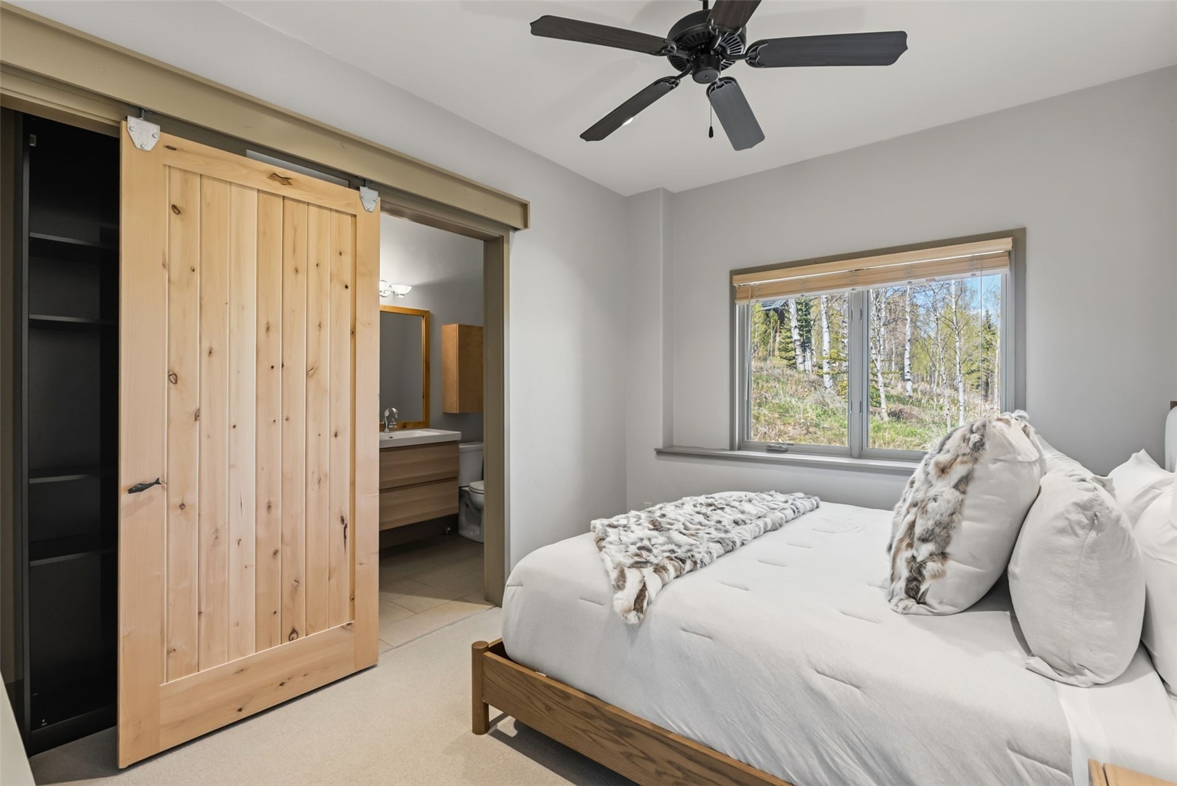 2800 Hunter's Knob Road Silverthorne, CO 80498 - Photo 19 of 37 a bedroom with a bed and a window