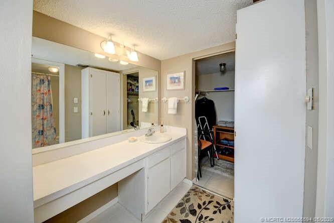 1950 Southwest Palm City Road, Unit 3209 Stuart, FL 34994 - Photo 25 of 64 En suite bedroom with walk in closet.