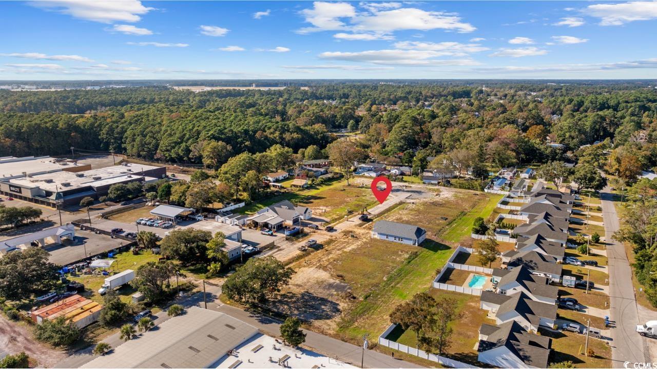 620 12th Avenue South Myrtle Beach, SC 29577 - Photo 30 of 40 Aerial view of The Villages at Withers Heights and surrounding areas with a forest and nearby areas.
