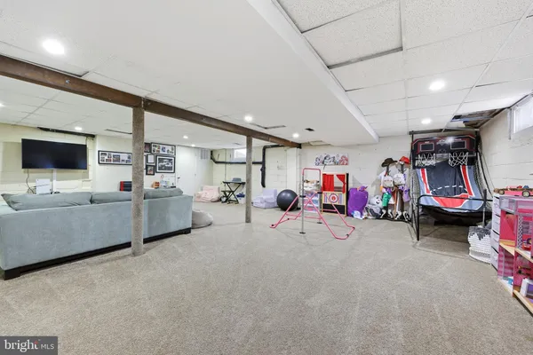 a view of a livingroom with furniture and a flat screen tv