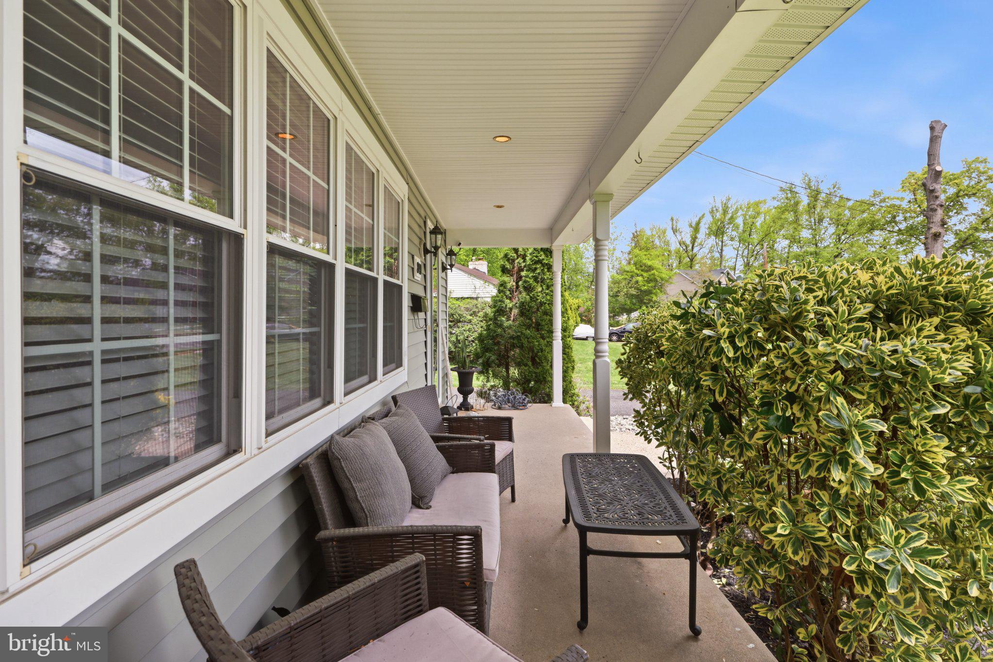 840 Cedar Avenue Haddonfield, NJ 08033 - Photo 5 of 49 Charming porch with lush greenery.