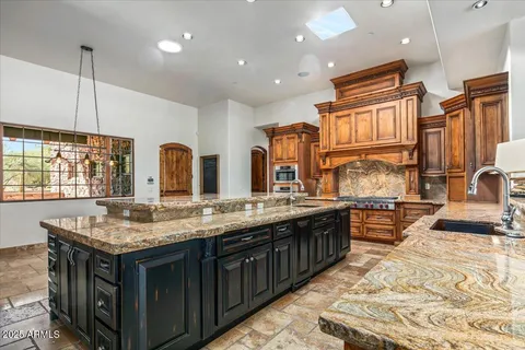 a bedroom with a bed couch and window