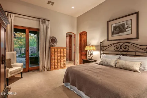 a view of a porch with furniture and a yard