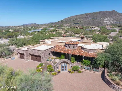 an aerial view of a house with a garden