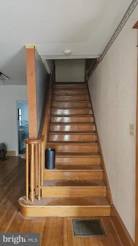 a view of a livingroom with furniture and a window
