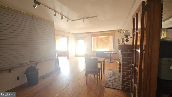a view of a kitchen with refrigerator and microwave