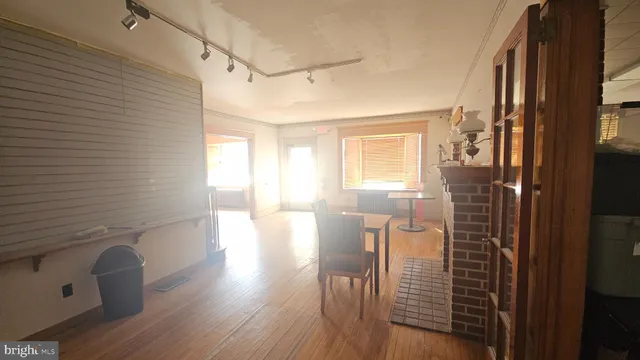 a view of a kitchen with refrigerator and microwave