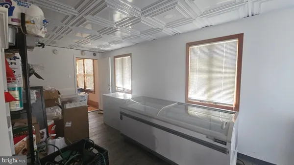 a view of a yard with wooden fence