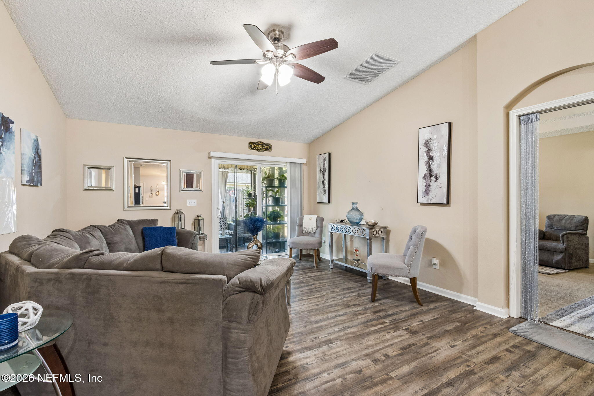 96034 Bass Lane Yulee, FL 32097 - Photo 14 of 50 a living room with furniture and a wooden floor
