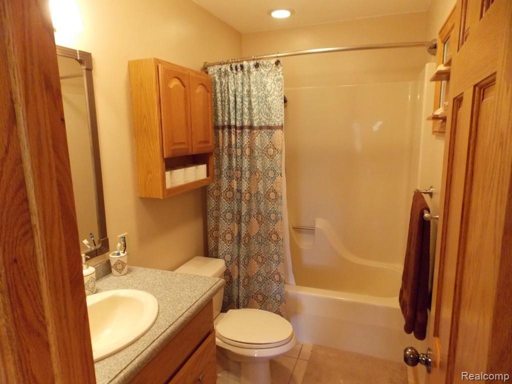 2974 Hannan Road Imlay City, MI 48444 - Photo 26 of 45 The full bath on the second floor has corian counters, and ceramic floors.