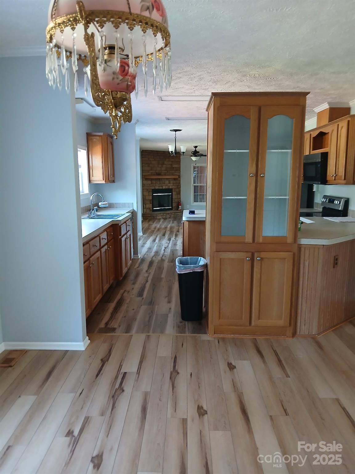 218 Muldoon Lane Clover, SC 29710 - Photo 11 of 26 a view of a kitchen with wooden floor and stainless steel appliances