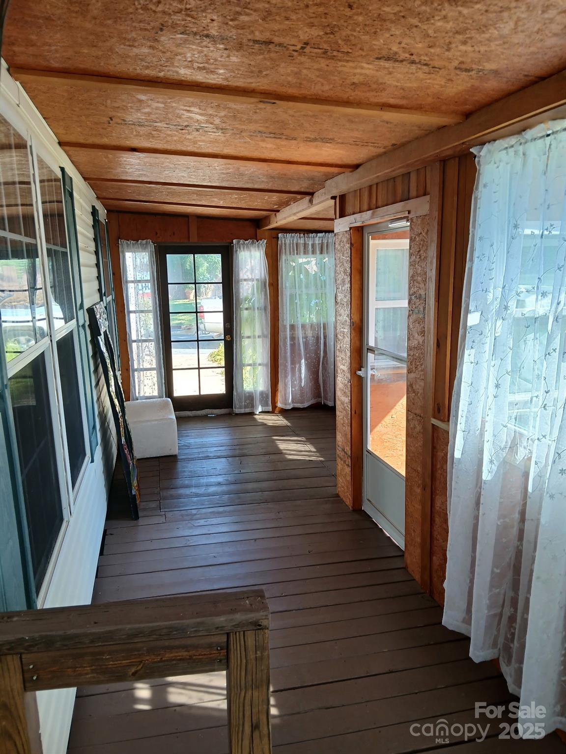 218 Muldoon Lane Clover, SC 29710 - Photo 15 of 26 a view of a hallway with wooden floor and furniture