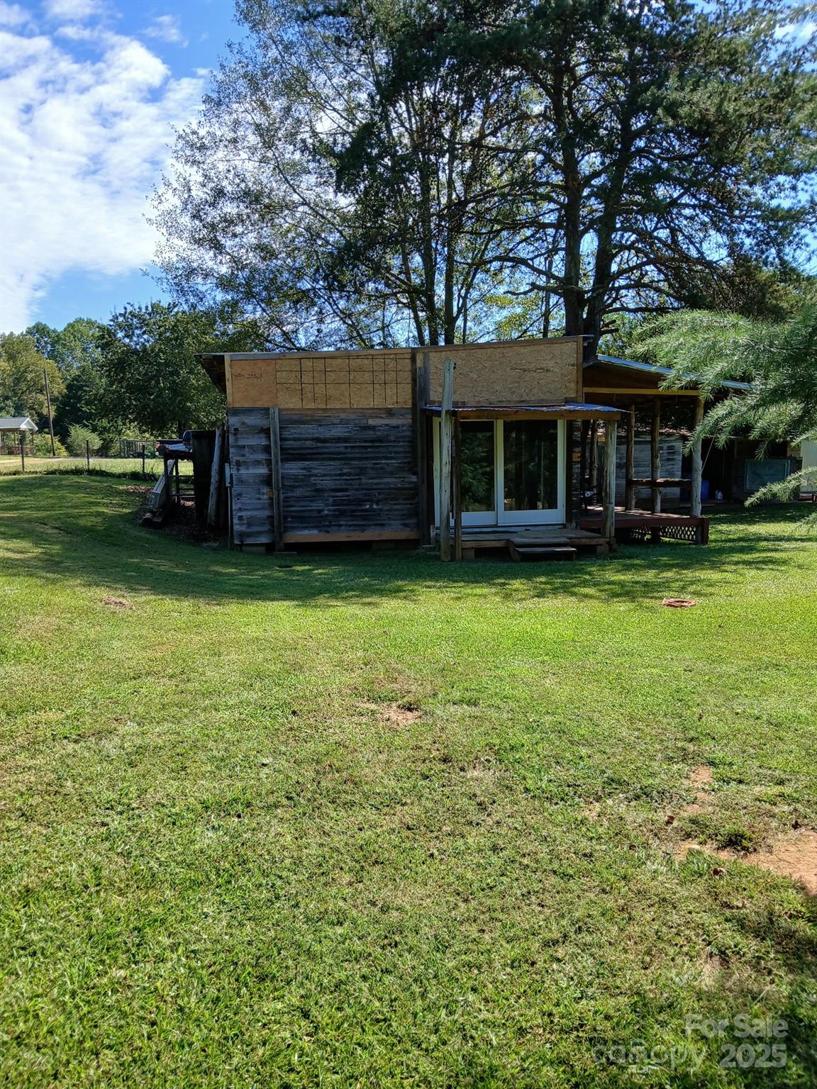 218 Muldoon Lane Clover, SC 29710 - Photo 19 of 26 a view of a house with a yard and sitting area