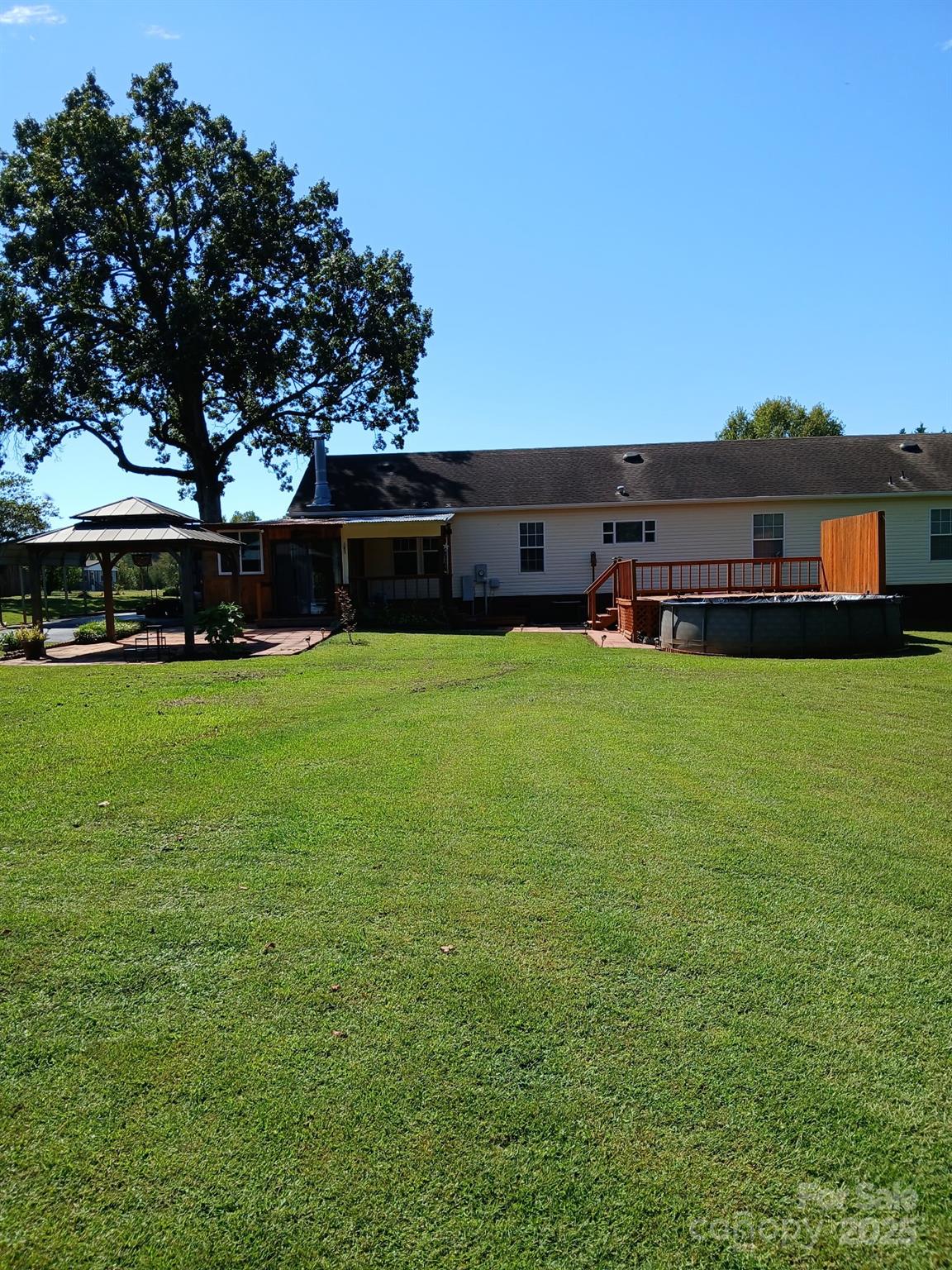 218 Muldoon Lane Clover, SC 29710 - Photo 26 of 26 a view of a house with a yard and sitting area