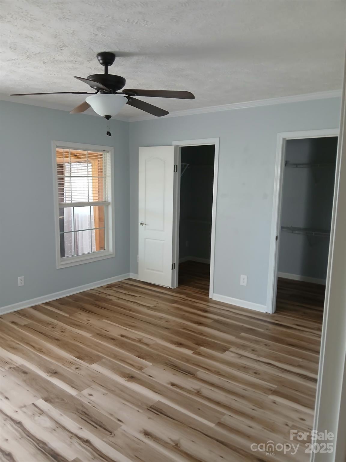 218 Muldoon Lane Clover, SC 29710 - Photo 8 of 26 a view of empty room with wooden floor and fan