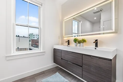 a bathroom with a sink and a mirror