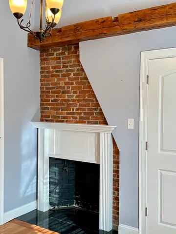 a view of an entryway with fireplace