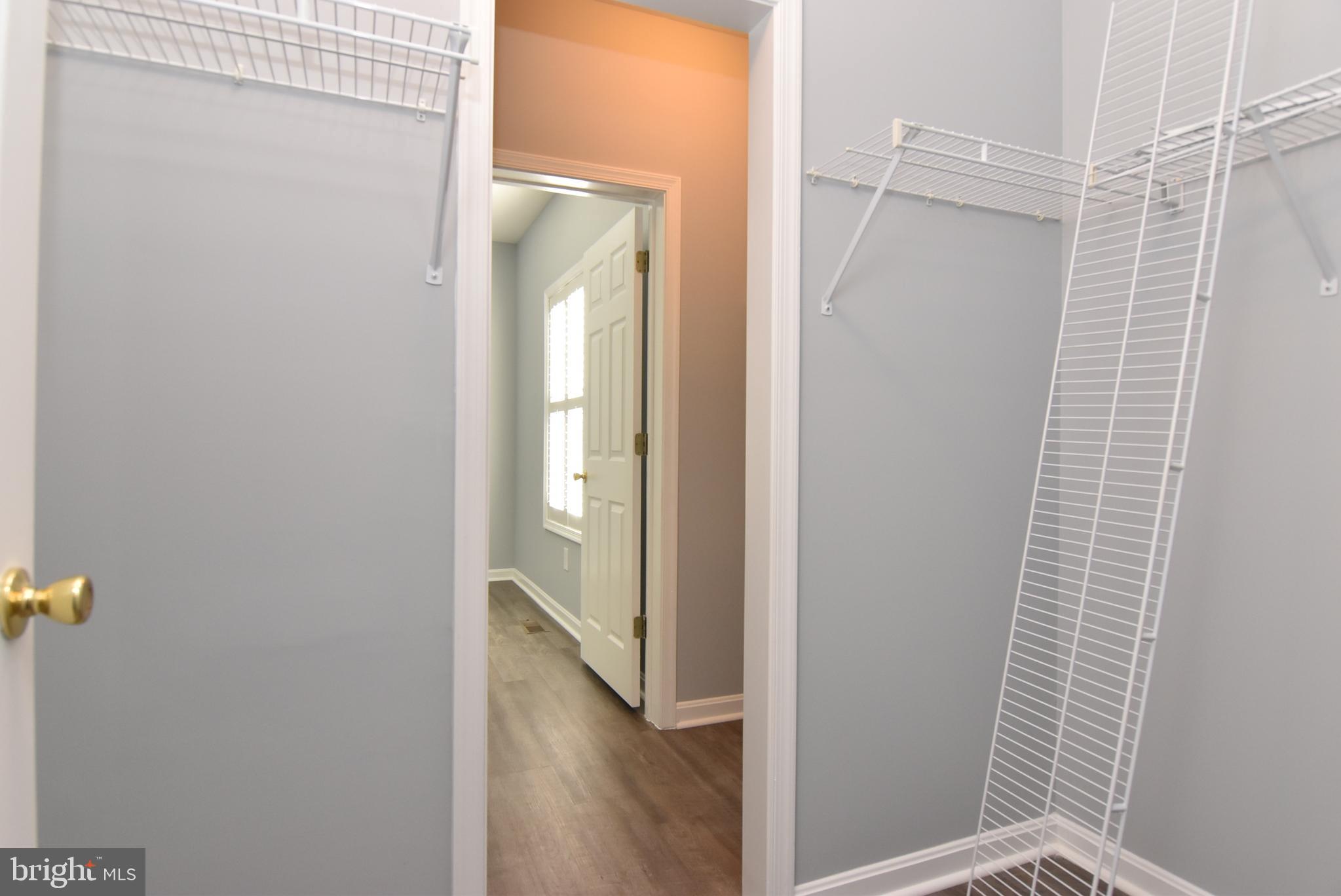 100 Cascade Lane, Unit 101 Rehoboth Beach, DE 19971 - Photo 19 of 26 a bathroom with a shower and a mirror