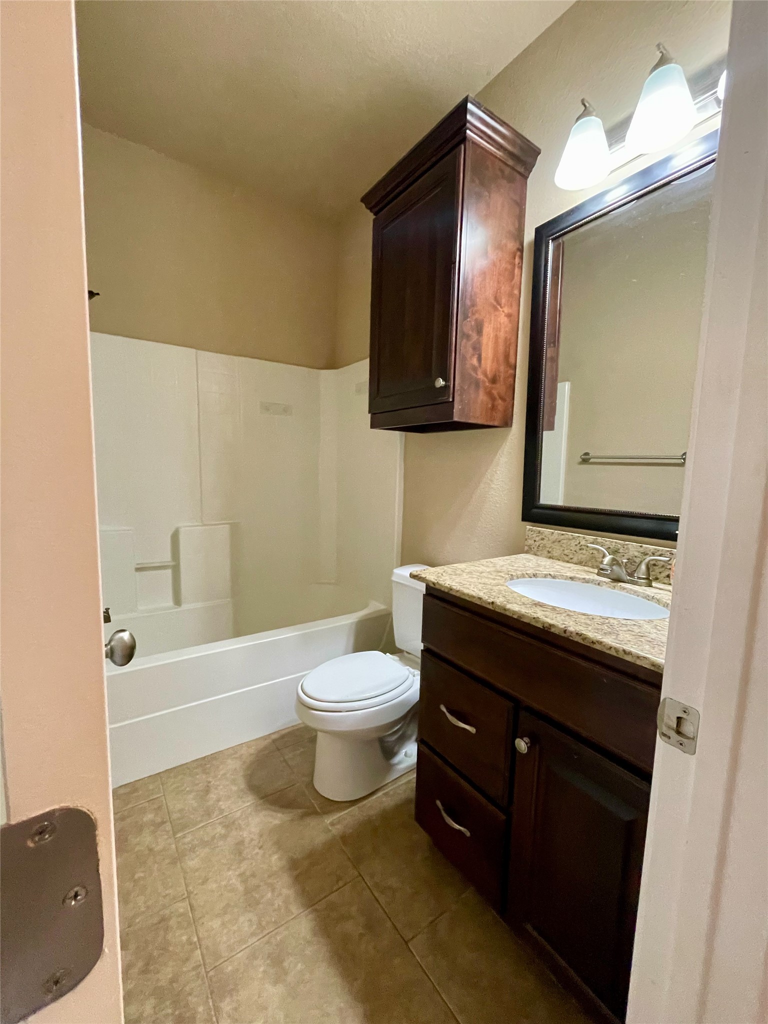 3519 Haverford Road College Station, TX 77845 - Photo 9 of 15 a bathroom with a toilet a sink a mirror and bathtub