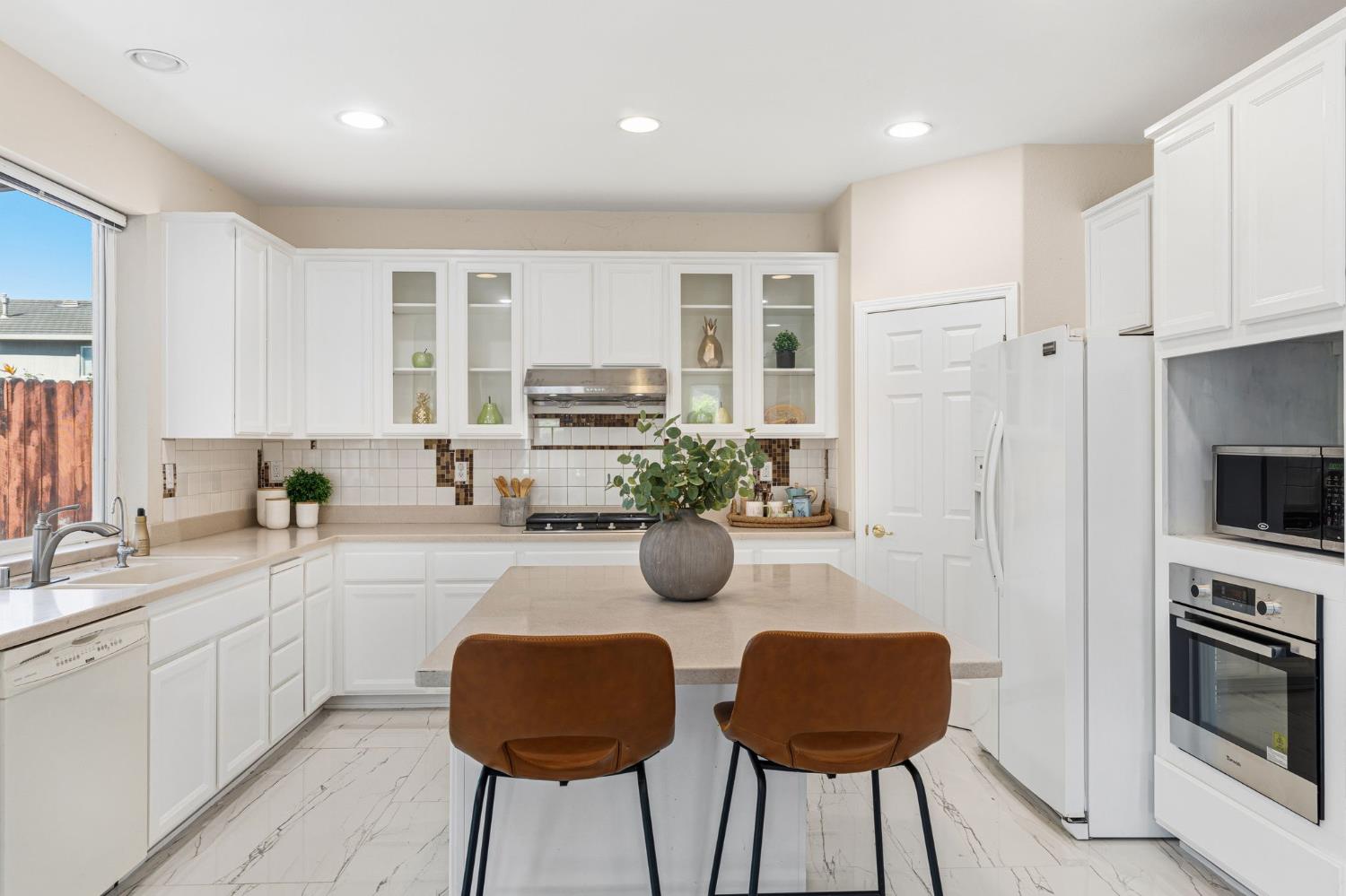 2603 Bellows Street Davis, CA 95618 - Photo 16 of 50 a kitchen with stainless steel appliances granite countertop a stove cabinets and a sink