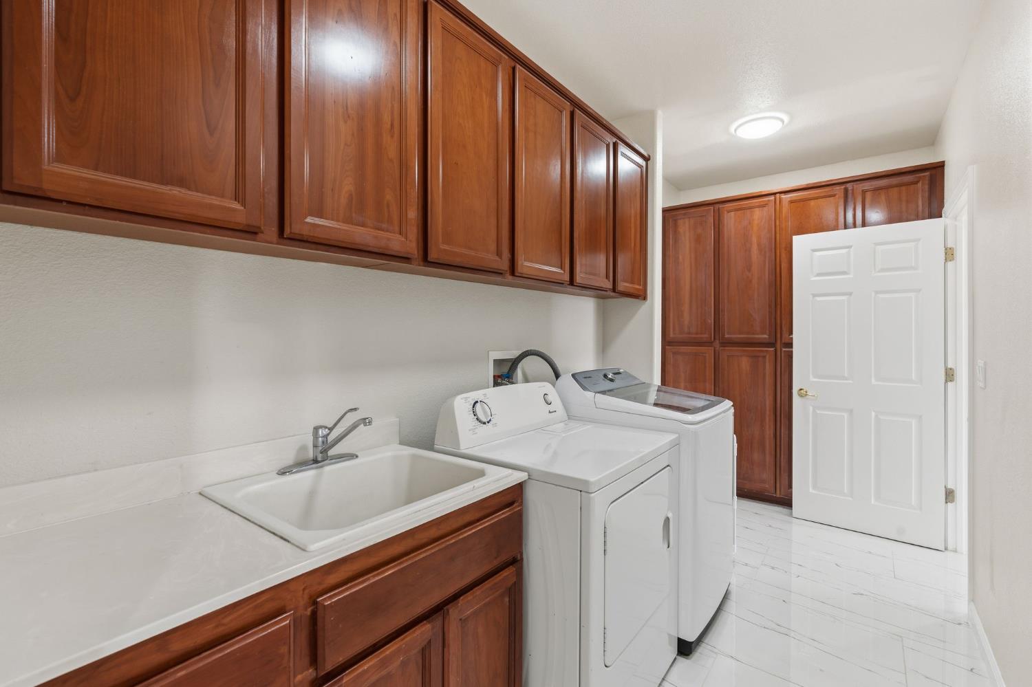 2603 Bellows Street Davis, CA 95618 - Photo 21 of 50 a utility room with cabinets