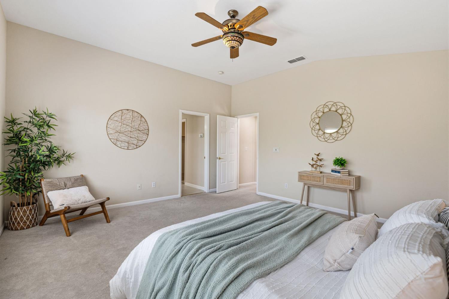 2603 Bellows Street Davis, CA 95618 - Photo 25 of 50 a bedroom with a bed a clock on the wall and a lamp