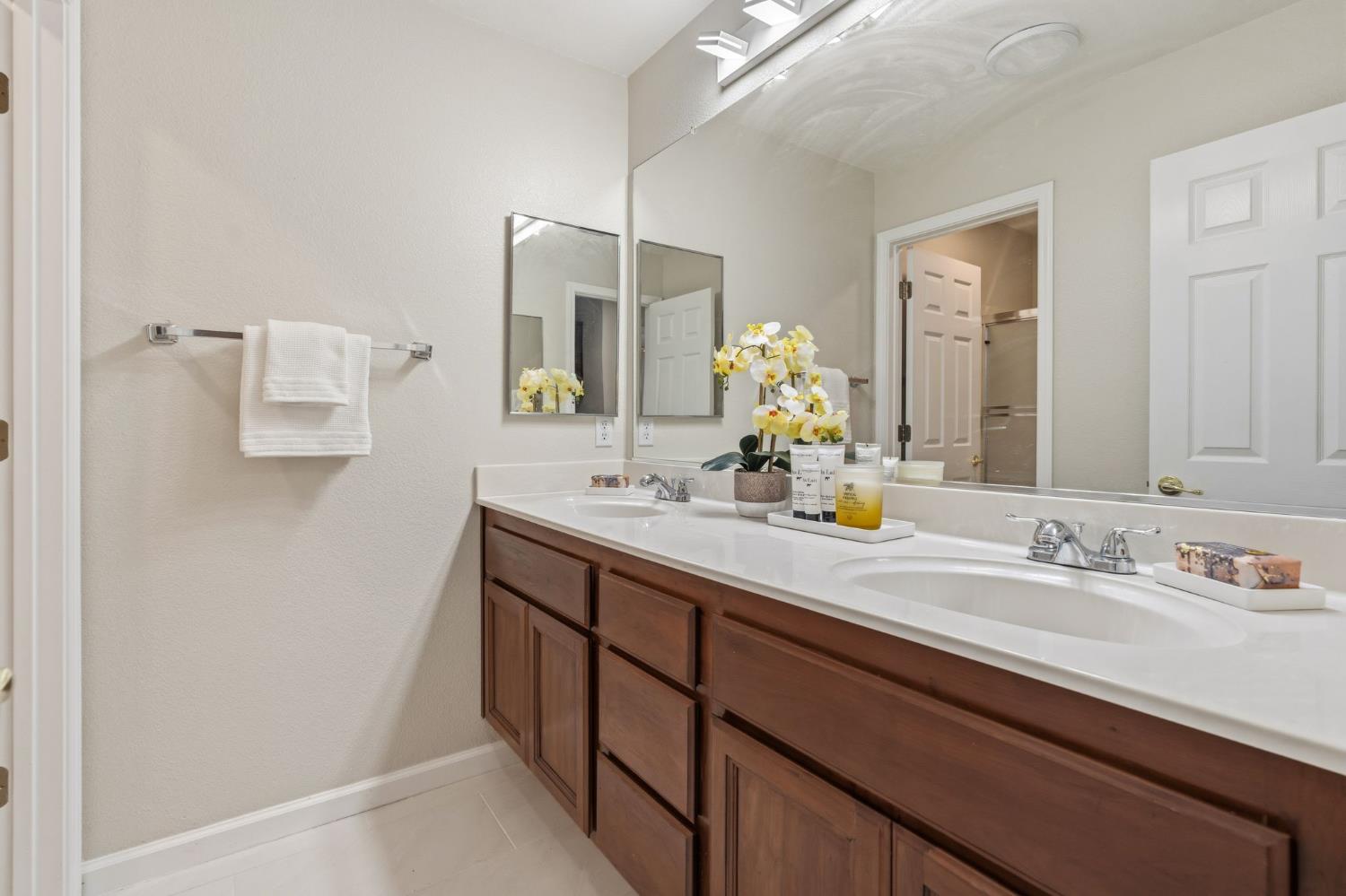 2603 Bellows Street Davis, CA 95618 - Photo 31 of 50 a bathroom with a sink and a mirror