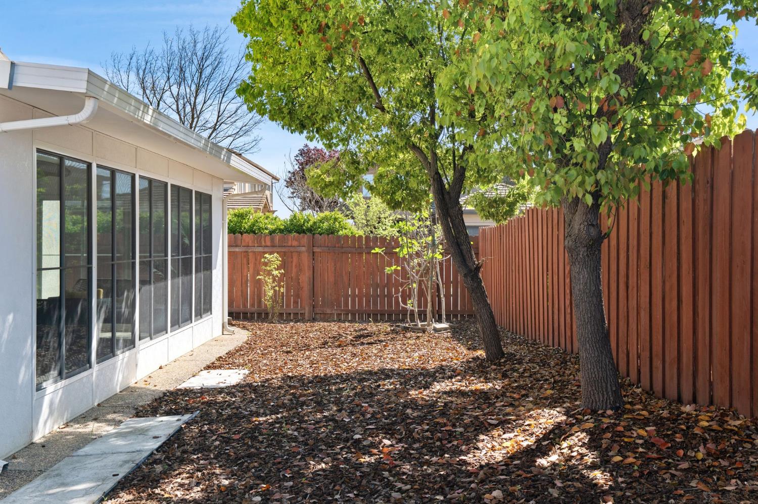 2603 Bellows Street Davis, CA 95618 - Photo 39 of 50 a view of a house with a small yard and wooden fence