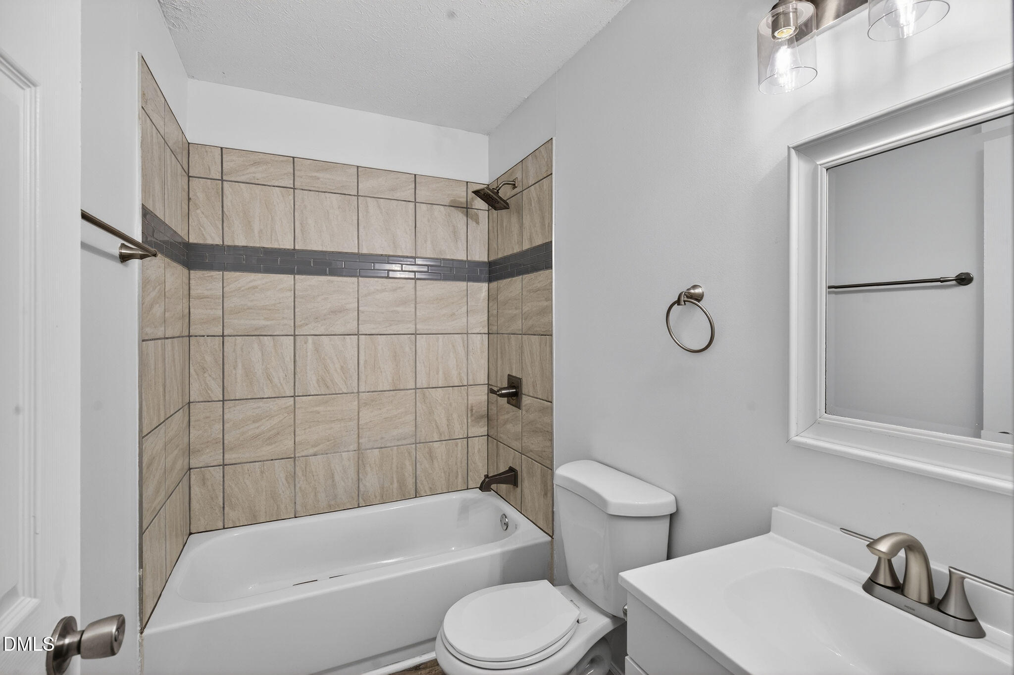 904 Seabrook Road Raleigh, NC 27610 - Photo 14 of 31 a bathroom with a sink toilet and shower