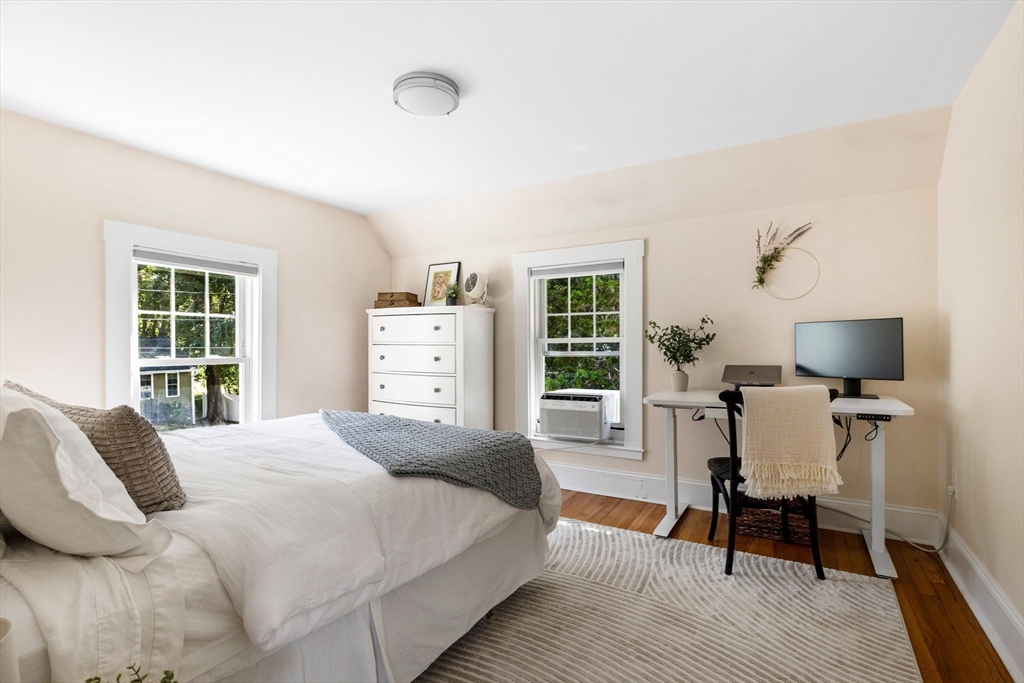 80 Washington Street Stoneham, MA 02180 - Photo 12 of 21 a bedroom with a bed and a chair