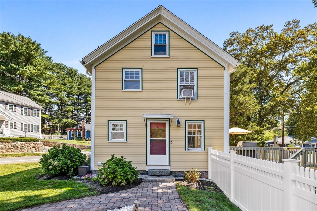 80 Washington Street Stoneham, MA 02180 - Photo 19 of 21 a front view of a house with garden