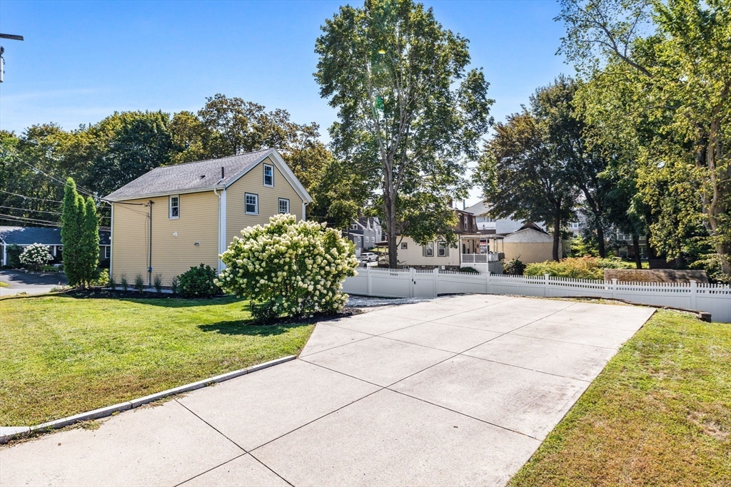 80 Washington Street Stoneham, MA 02180 - Photo 20 of 21 a view of swimming pool with a garden