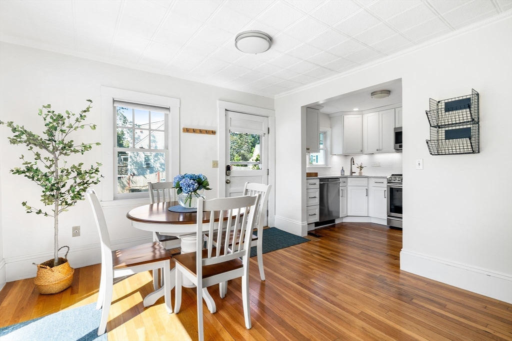 80 Washington Street Stoneham, MA 02180 - Photo 3 of 21 a dining room with furniture and wooden floor