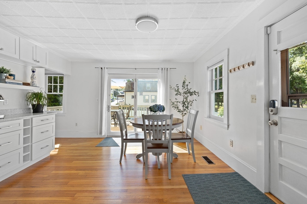 80 Washington Street Stoneham, MA 02180 - Photo 5 of 21 a view of a dining room with furniture and wooden floor