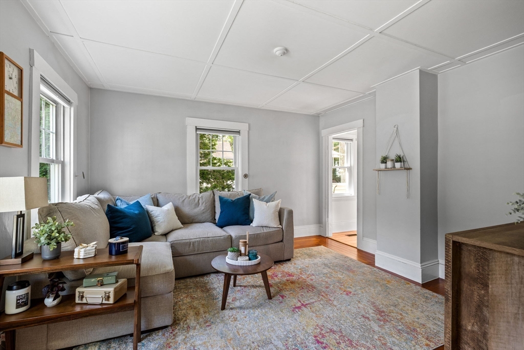 80 Washington Street Stoneham, MA 02180 - Photo 7 of 21 a living room with furniture and a window